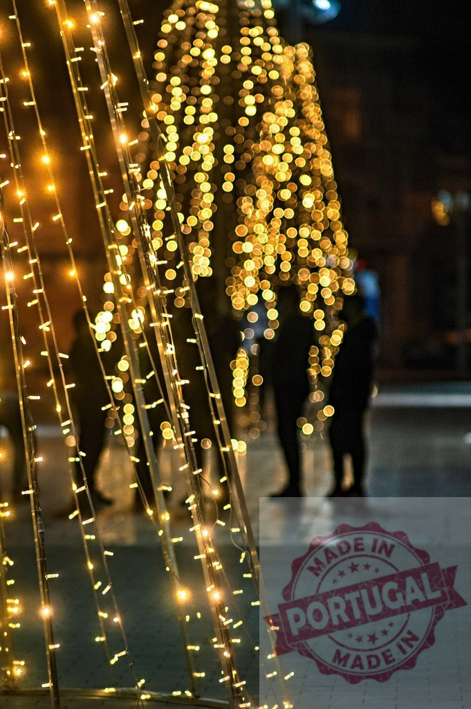 Christmas lights creating bokeh at night | Christmas lights and blurred people celebrating holiday evening at night creating festive bokeh - Realized with Pictrs.com