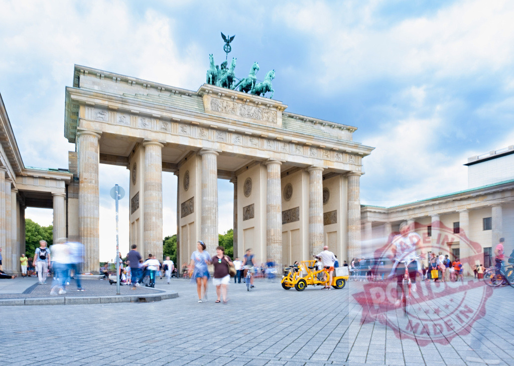 Brandenburg Gate with blurred motion people moving | Brandenburg Gate in Berlin experiencing tourist activity and movement with motion blur - Realized with Pictrs.com
