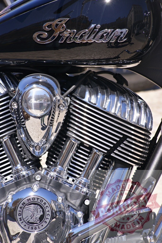 Indian Motorcycle engine with shining chrome details | Indian Motorcycle engine displaying its V-twin cylinders and chrome parts - Realized with Pictrs.com