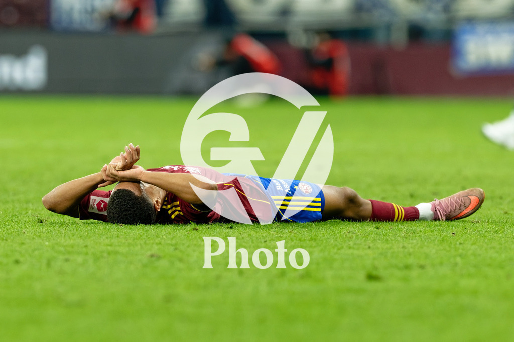 Brack Super League - Servette FC v FC Lausanne-Sport | Lilian Njoh (14 Servette FC) looks dejected after losing during the Brack Super League match between Servette FC and FC Lausanne-Sport at Stade de Geneve in Geneva, Switzerland