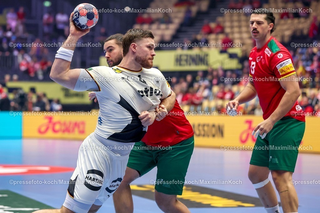 EHF22012601022 | 22.01.2026, Handball, Men's EHF EURO 2026, Deutschland - Portugal, Jyske Bank Boxen in Herning, Dänemark, Main Round:  Johannes Golla (Germany #04) im Zweikampf gegen   Luis Diogo Sousa Frade (Portugal #82) 