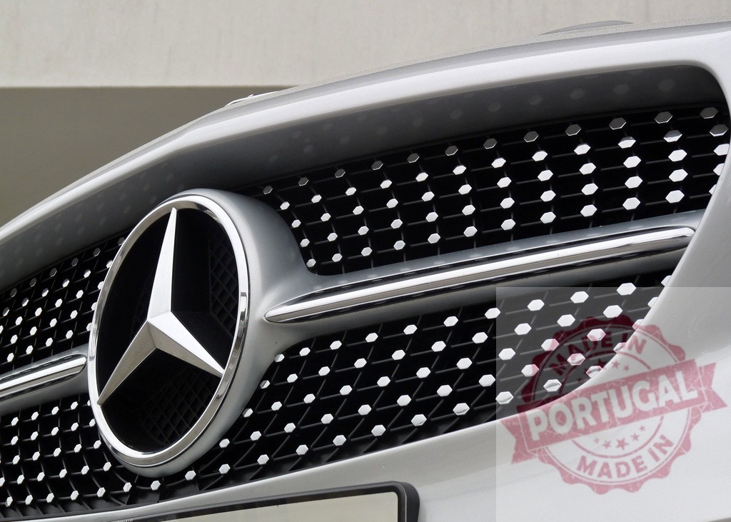 Mercedes-Benz logo detail on car grille | Mercedes-Benz emblem displaying luxury and automotive design on modern car grille - Realisiert mit Pictrs.com