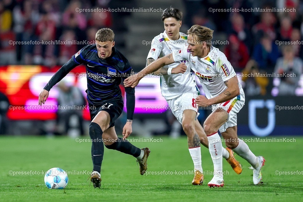 1FC05042501032 | 05.04.2025, Fußball, 1. FC Köln - Hertha BSC, 2.. Fußball Bundesliga, 28. Spieltag, RheinEnergie-STADION, Saison 2024 2025: Michael Cuisance (Hertha BSC #27) im Zweikampf gegen Denis Huseinbasic (FC Koeln #8) und Mathias Olesen (FC Koeln #47) DFB regulations prohibit any use of photographs as image sequences and or quasi-video.