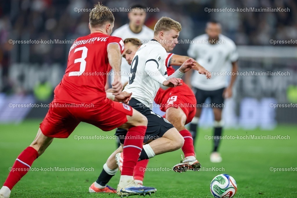DFB10102501124 | 10.10.2025, Fußball, Länderspiel, Deutschland - Luxemburg, UEFA WM-Qualifikation, 2025/2026, Gruppe A, PreZero Arena in Sinsheim: Jonathan Burkhardt (GER #19) im Zweikampf gegen  Enes Mahmutovic (LUX #03) DFB regulations prohibit any use of photographs as image sequences and or quasi-video.