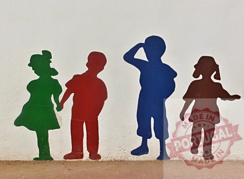 Colorful children silhouettes mural representing friendship and youth | Colorful children silhouettes painted on a white wall, symbolizing friendship and childhood - Realized with Pictrs.com