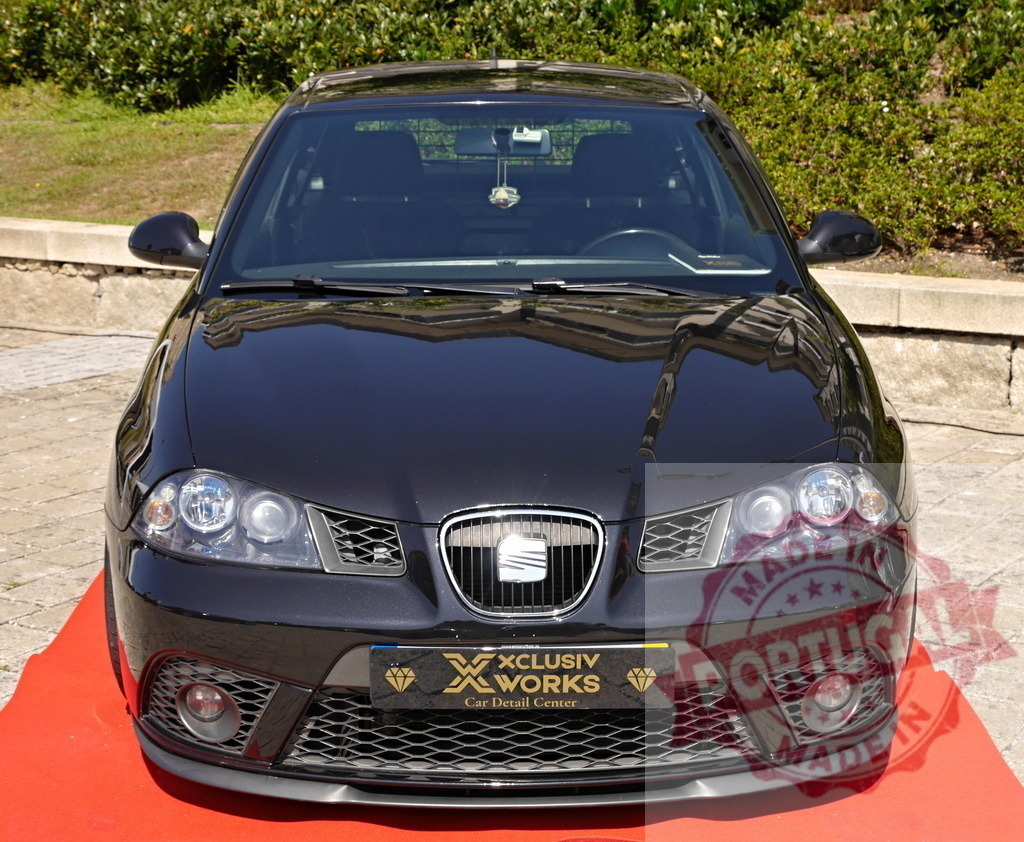 SEAT Ibiza car showing detailed clean black paint | SEAT Ibiza car displayed on red carpet presenting a glossy black finish - Realized with Pictrs.com