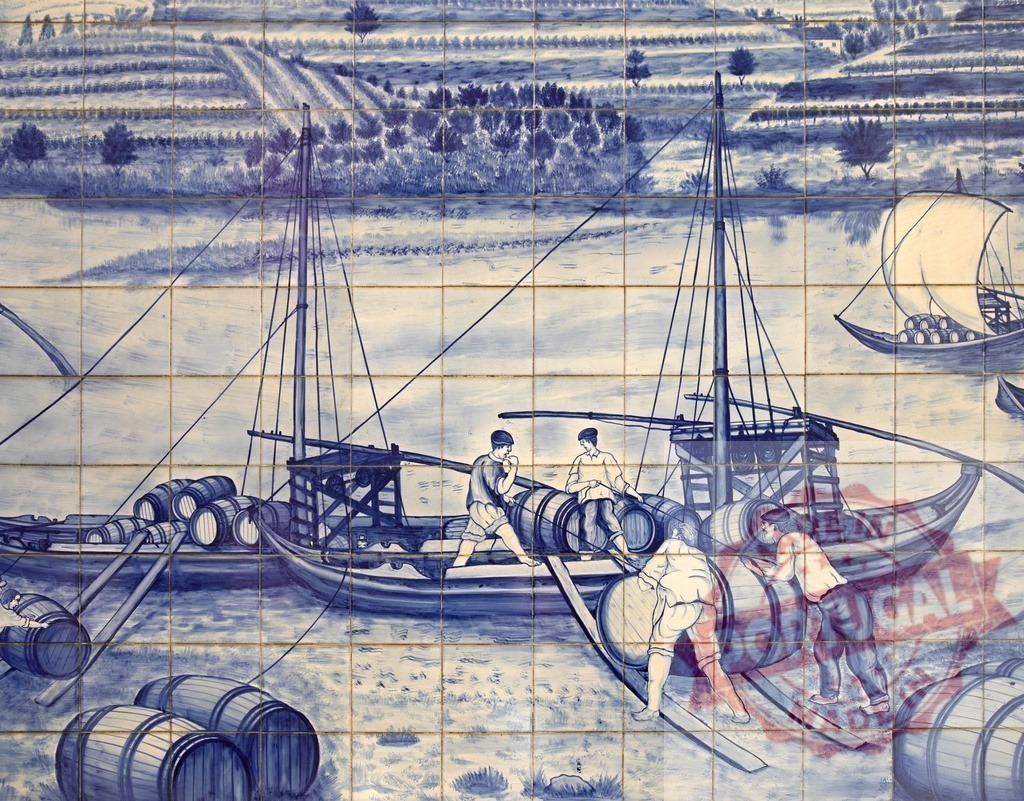 Azulejo mural depicting Rabelo boat shipping Port wine | Traditional Portuguese azulejos showing workers loading barrels onto Rabelo boats on Douro River - Realized with Pictrs.com