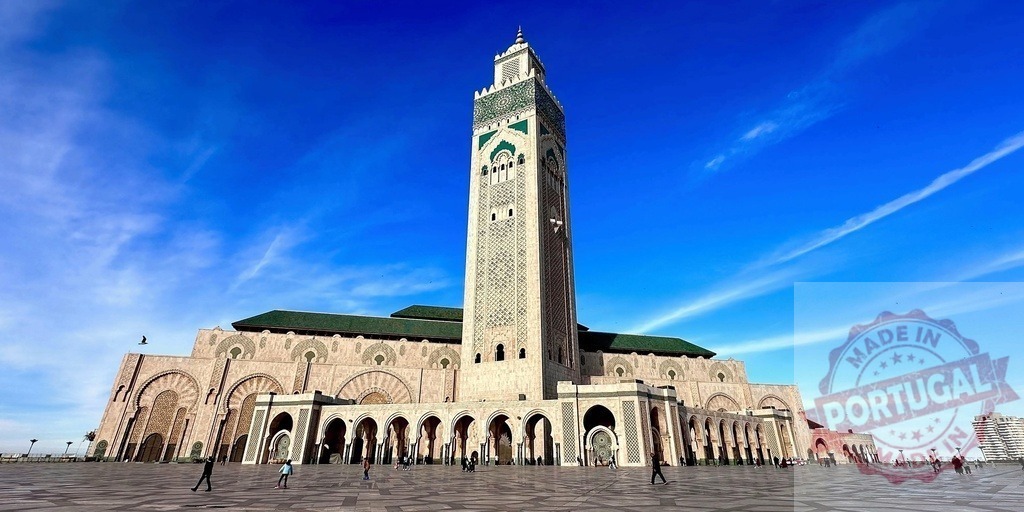 Majestic Hassan II Mosque in Casablanca Morocco Under Blue Sky | Grand view of Hassan II Mosque showcasing its tall minaret and stunning architecture - Realized with Pictrs.com