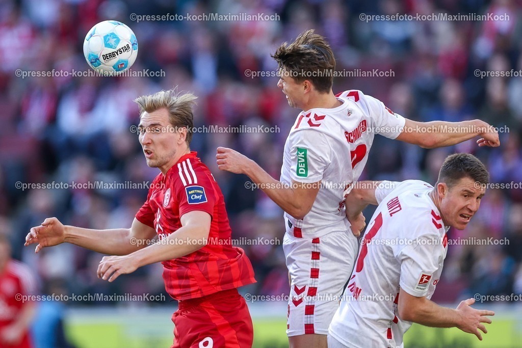 1FC23022502202 | 23.02.2025, Fußball, 1. FC Köln - Fortuna Düsseldorf, 2.. Fußball Bundesliga, 23. Spieltag, RheinEnergie-STADION, Saison 2024 2025: Vincent Vermeij (Fortuna Düsseldorf #9) im Zweikampf gegen Joel Schmied (FC Köln #2) und Dominique Heintz (FC Köln #3)DFB regulations prohibit any use of photographs as image sequences and or quasi-video.