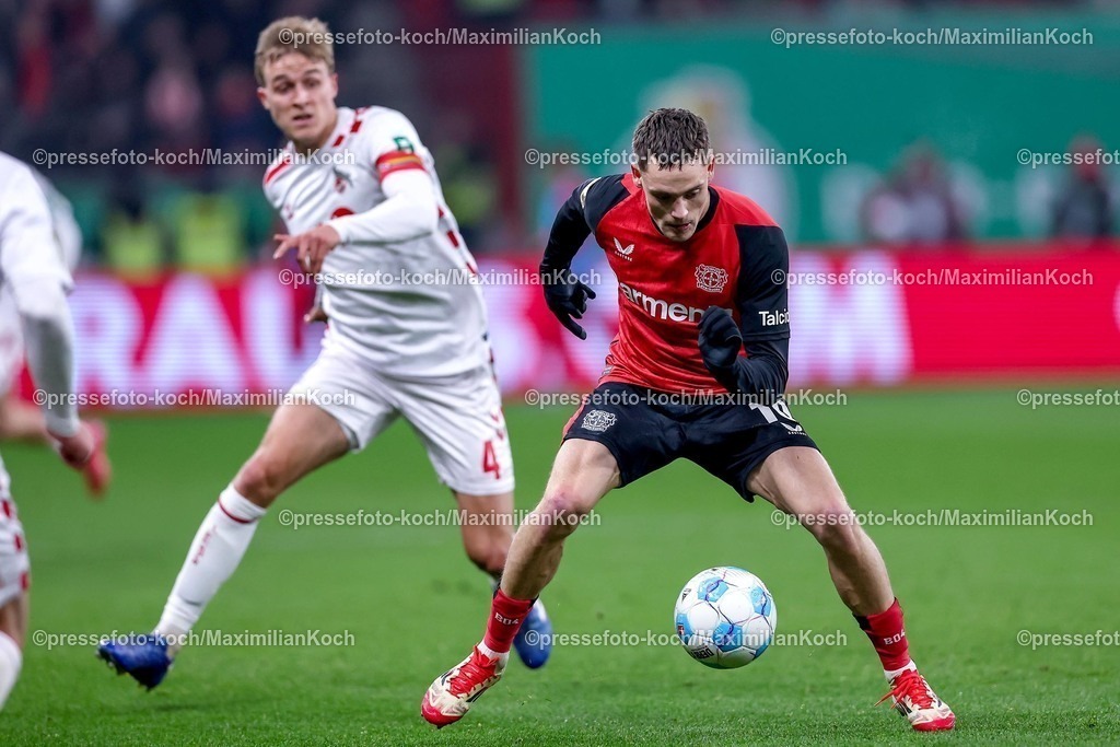 DFB05022501027 | 05.02.2025, Fußball, DFB-Pokal Viertelfinale, Bayer 04 Leverkusen - 1.FC Köln, BayArena, Saison 2024 2025: Timo Hübers (FC Köln #4) im Zweikampf gegen Florian Wirtz (Bayer04 Leverkusen #10)DFB regulations prohibit any use of photographs as image sequences and or quasi-video.