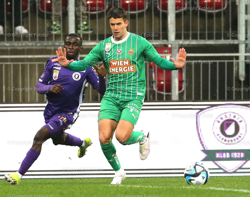 A_LUI_10032024_05 | SPORT,FUSSBALL, ADMIRAL BUNDESLIGA AUSTRIA KLAGENFURT-SK RAPID WIEN 10.03.2024 IM BILD: SOLOMON BONNAH (KLAGENFURT) UND JONAS AUER (RAPID WIEN) FOTO:FOTOLUI/MW