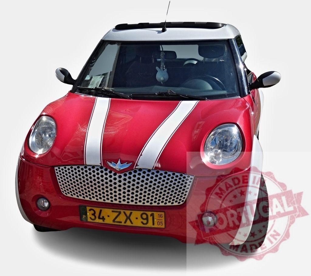 Red Microcar with White Stripes Parked on White Background | Stylish compact city car parked, showcasing modern microcar design and urban mobility - Realisiert mit Pictrs.com
