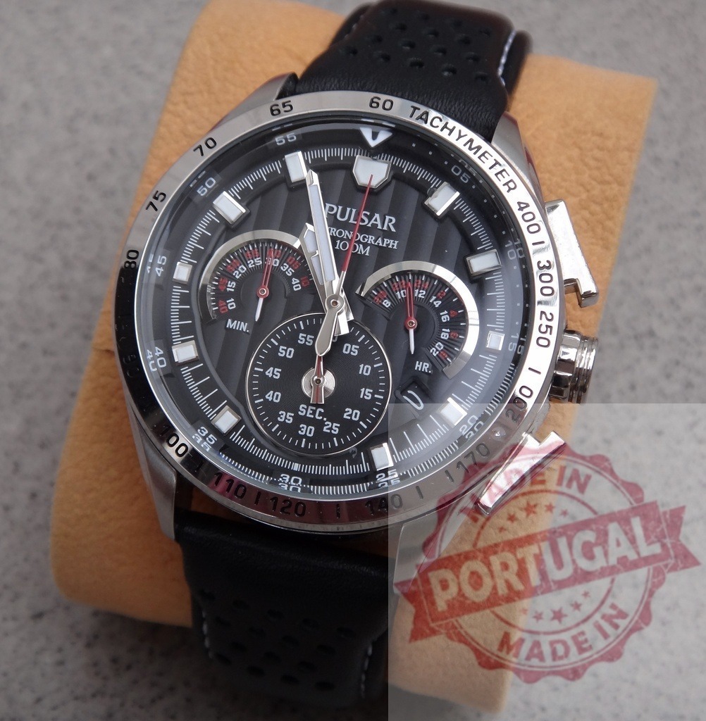 Pulsar chronograph watch with black leather strap | Pulsar chronograph watch showcasing intricate dial details and tachymeter on a display cushion - Realisiert mit Pictrs.com