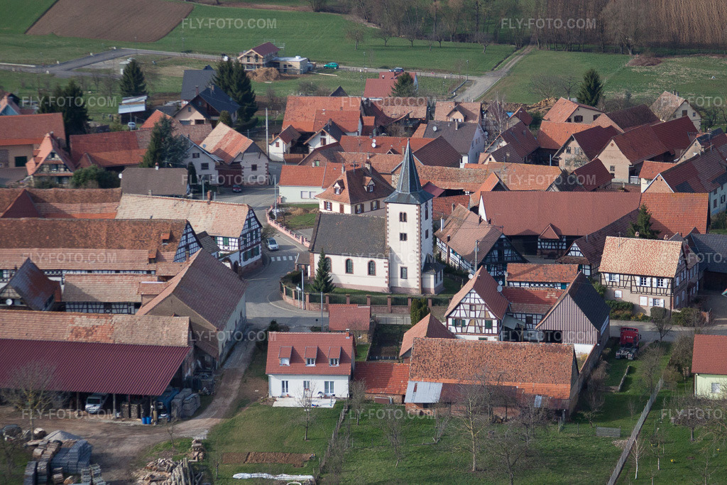 Aerial view: Eglise protestant luthérienne Buswiller in Buswiller in the state Bas-Rhin, France. – Photo: IMG_38615.jpg taken on 03/20/2011 by Werner Riehm/FLY-FOTO.com – Resolution of the original: 4752 x 3168 px
