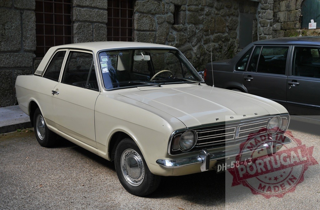 Ford Cortina classic car driving history and nostalgia | Ford Cortina Mark II vintage car parked on a paved surface next to stone wall building - Realisiert mit Pictrs.com