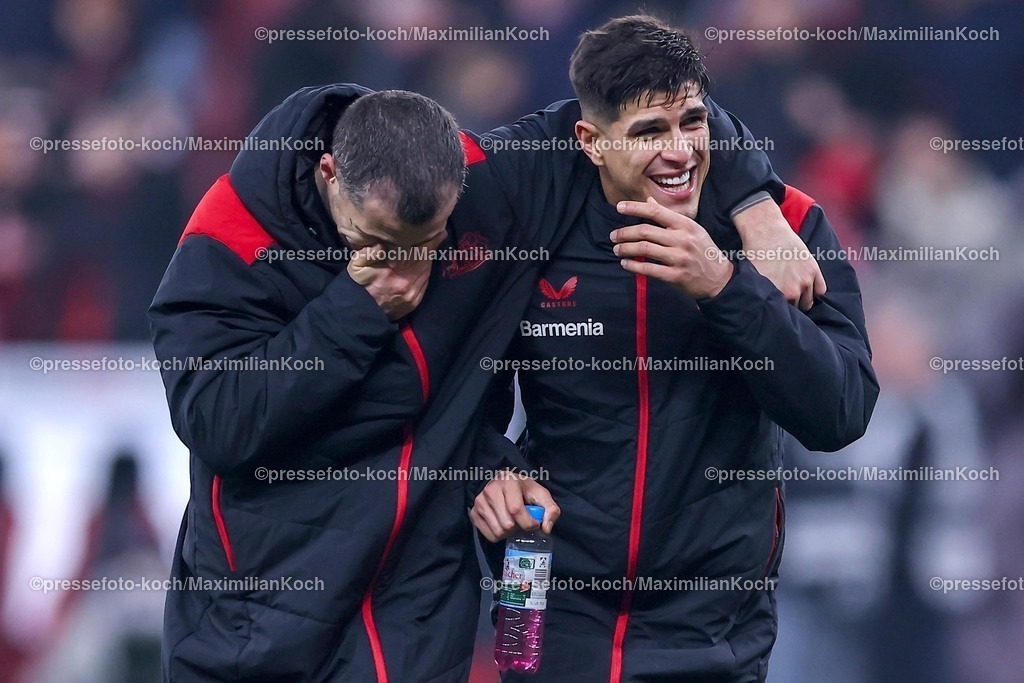 DFB05022501128 | 05.02.2025, Fußball, DFB-Pokal Viertelfinale, Bayer 04 Leverkusen - 1.FC Köln, BayArena, Saison 2024 2025: Gute laune bei Granit Xhaka (Bayer04 Leverkusen #34) und Piero Hincapie (Bayer04 Leverkusen #3) nach dem 3:2 SiegDFB regulations prohibit any use of photographs as image sequences and or quasi-video.
