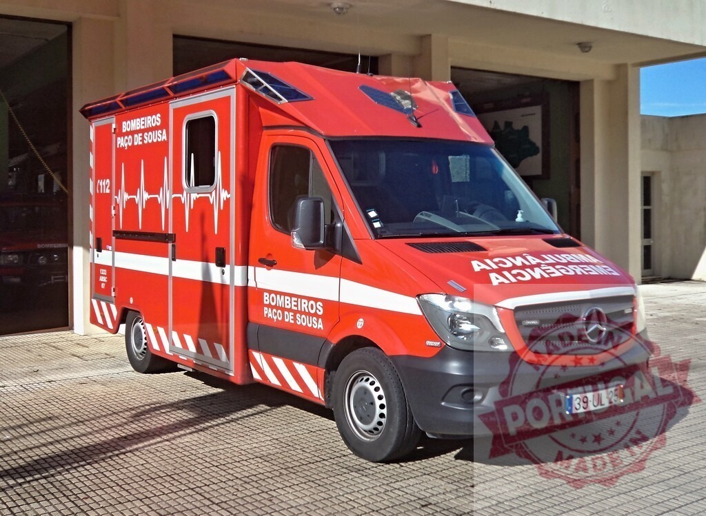 Red emergency ambulance vehicle from Bombeiros Paço de Sousa | Red Mercedes-Benz ambulance parked outside a fire station, ready for emergency response - Realisiert mit Pictrs.com