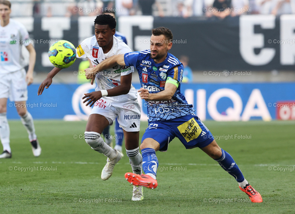 A_LUI_010525_00004 | SPORT,FUSSBALL,RZ PELLETS WOLFSBERG-TSV HARTBERG 01.05.2025 IM BILD : EMMANUELAGYMANG (WAC) UND JUERGERN HEIL  (TSVHARTBERG) FOTO:FOTOLUI/MW