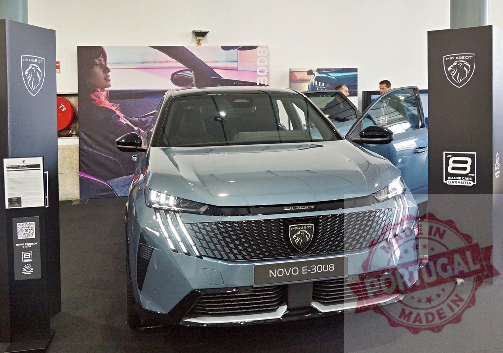 Peugeot E-3008 electric SUV front view at auto show | Peugeot E-3008 electric SUV on display, showcasing modern design and automotive technology - Realized with Pictrs.com