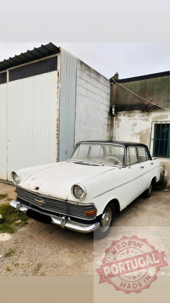Old white Opel Rekord parked near abandoned building | Vintage Opel Rekord car sitting weathered and rusty next to an aged industrial wall - Realized with Pictrs.com