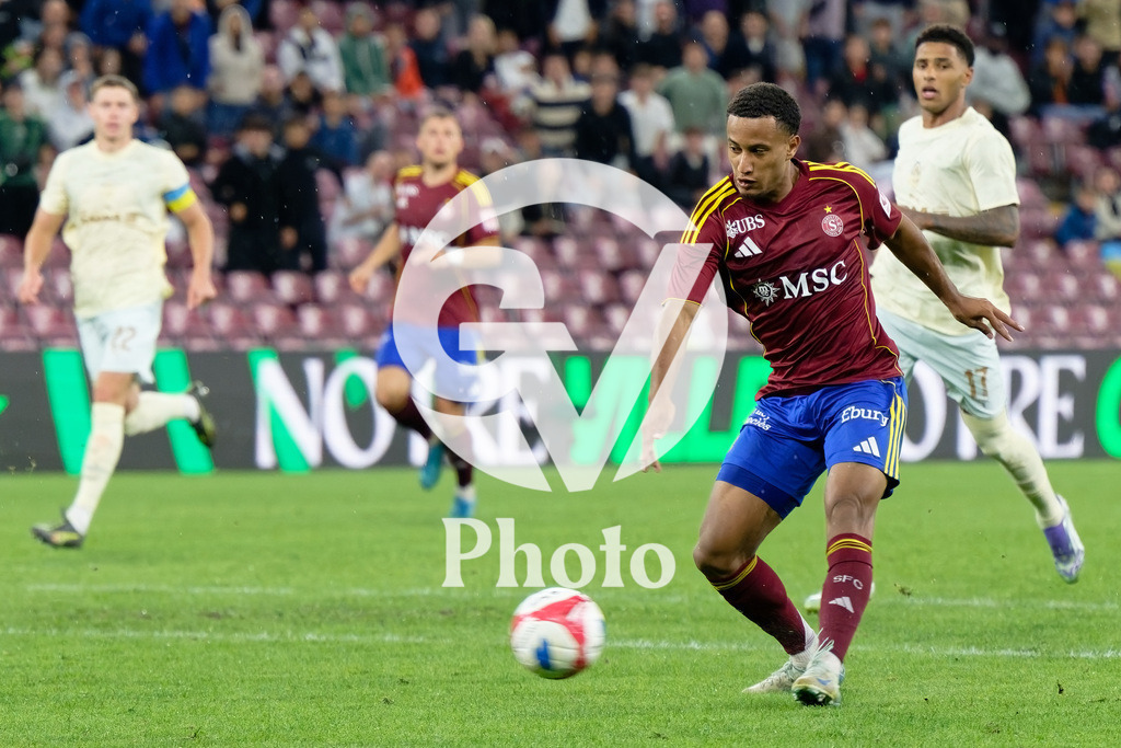 UEFA Conference League Play-offs 2nd leg - Servette FC v FC Shakhtar Donetsk | Lilian Njoh (14 Servette FC) shoots the ball (action)  during the UEFA Conference League Play-offs 2nd leg match between Servette FC and FC Shakhtar Donetsk at Stade de Geneve in Geneva, Switzerland