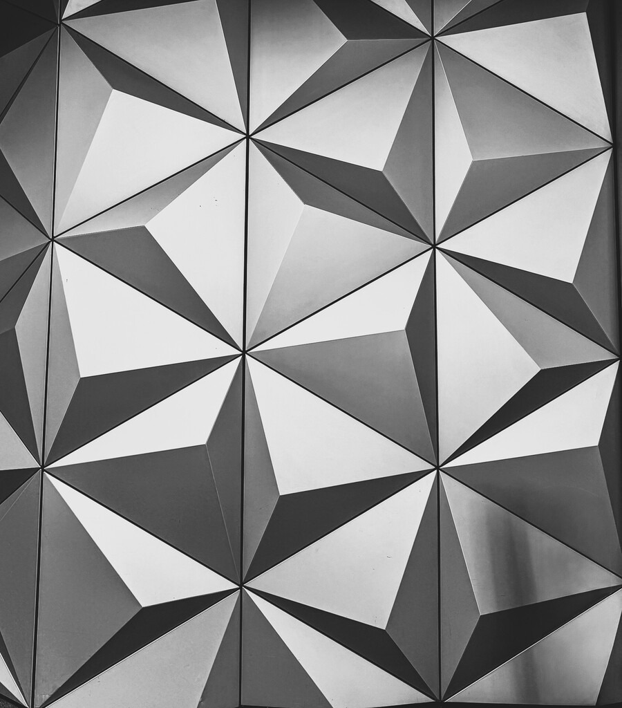 Futuristic monochrome geometric wall texture | Minimalist black and white geometric wall texture with strong symmetry, sharp contrasts and futuristic architectural design. This monochrome abstract pattern creates a modern visual atmosphere inspired by contemporary architecture, optical illusion art and urban textures. - Realisiert mit Pictrs.com