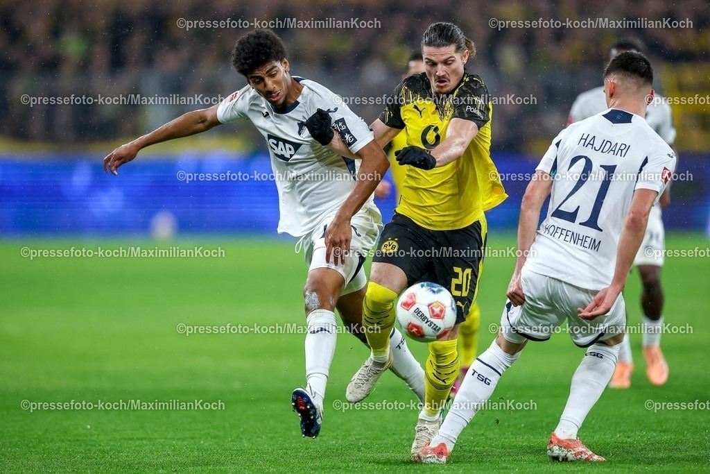BVB07122501014 | 07.12.2025, Fußball, Borussia Dortmund - TSG 1899 Hoffenheimt, 1. Fußball Bundesliga, 13. Spieltag, Signal Iduna Park, Saison 2025 2026: Marcel Sabitzer&nbsp;(BVB #20) im Zweikampf gegen  Bernardo&nbsp;(TSG Hoffenheim #13) Albian Hajdari&nbsp;(TSG Hoffenheim #21)  DFB regulations prohibit any use of photographs as image sequences and or quasi-video.