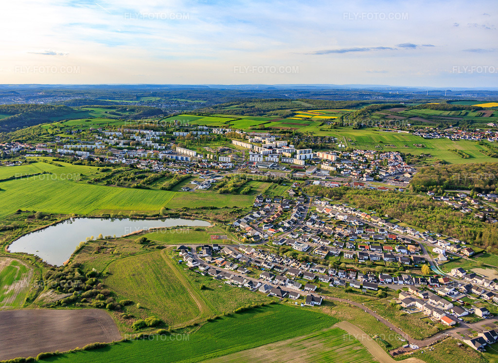 Aerial view: View of the town from the south in Farébersviller in the state Moselle, France.Photo: IMG_154249.jpg taken on 04/17/2026 by Werner Riehm/FLY-FOTO.comResolution of the original: 5270 x 3842 px
