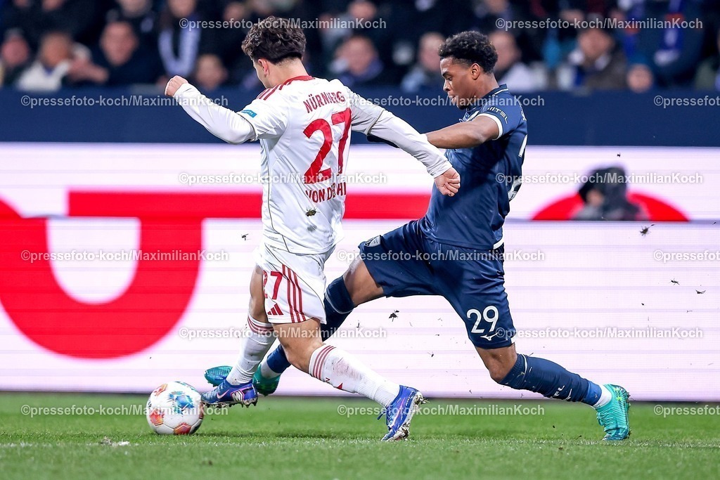 BOC20022601013 | 20.02.2026, Fußball, VfL Bochum - 1. FC Nürnberg, 2. Fußball Bundesliga, 23. Spieltag, Vonovia Ruhrstadion, Saison 2025 2026: Justin von der Hitz&nbsp;(1FC Nuernberg #27) im Zweikampf gegen  Farid Alfa-Ruprecht&nbsp;(VfL Bochum #29)  DFB regulations prohibit any use of photographs as image sequences and or quasi-video.