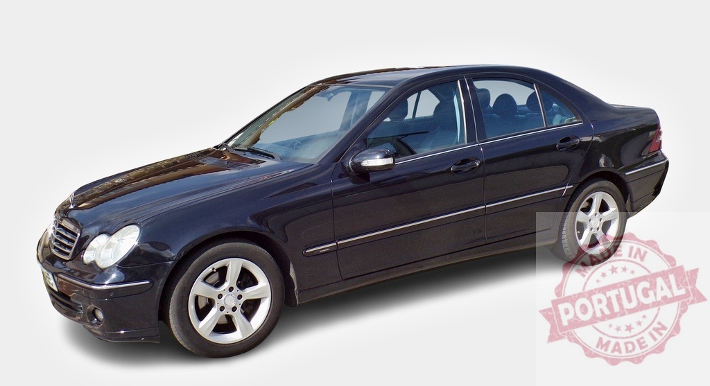 Black Mercedes-Benz C-Class W203 elegance parked on white background | Shiny black Mercedes-Benz C-Class W203 sedan standing out against a clean white backdrop, showcasing its sophisticated design - Realized with Pictrs.com
