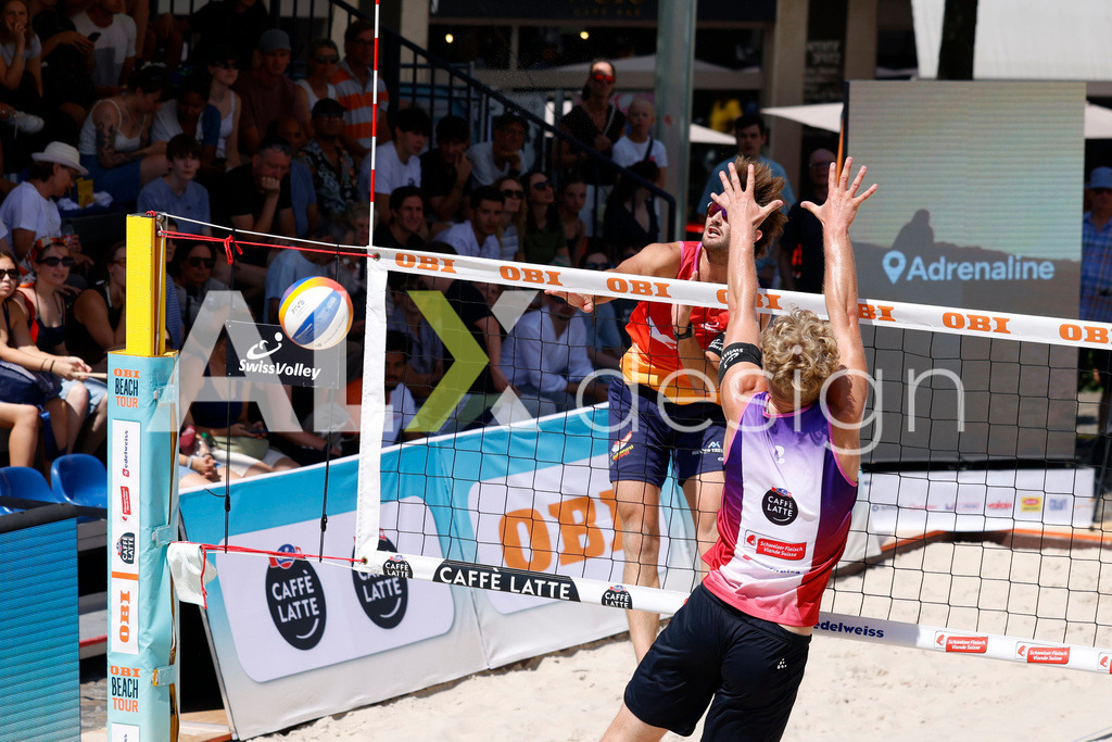 Obi BeachTour 2026 - Basel | BASEL, SWITZERLAND - JULY 18: LEO DILLIER (SUI) attack / spike against MATHIS KÄLIN (SUI) block during the Obi BeachTour 2026 match between DILLIER / FLÜCKIGER (SUI) and BREER / KÄLIN (SUI) at Barfüsserplatz on July 18, 2026 in Basel, Switzerland. - Realisiert mit Pictrs.com