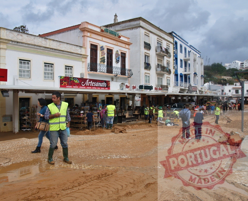 Volunteers cleaning mud from city street after flood disaster | Albufeira Flood - discruction by weather problems A team of volunteers clearing mud and debris from a street in a European town after a flood - Realized with Pictrs.com