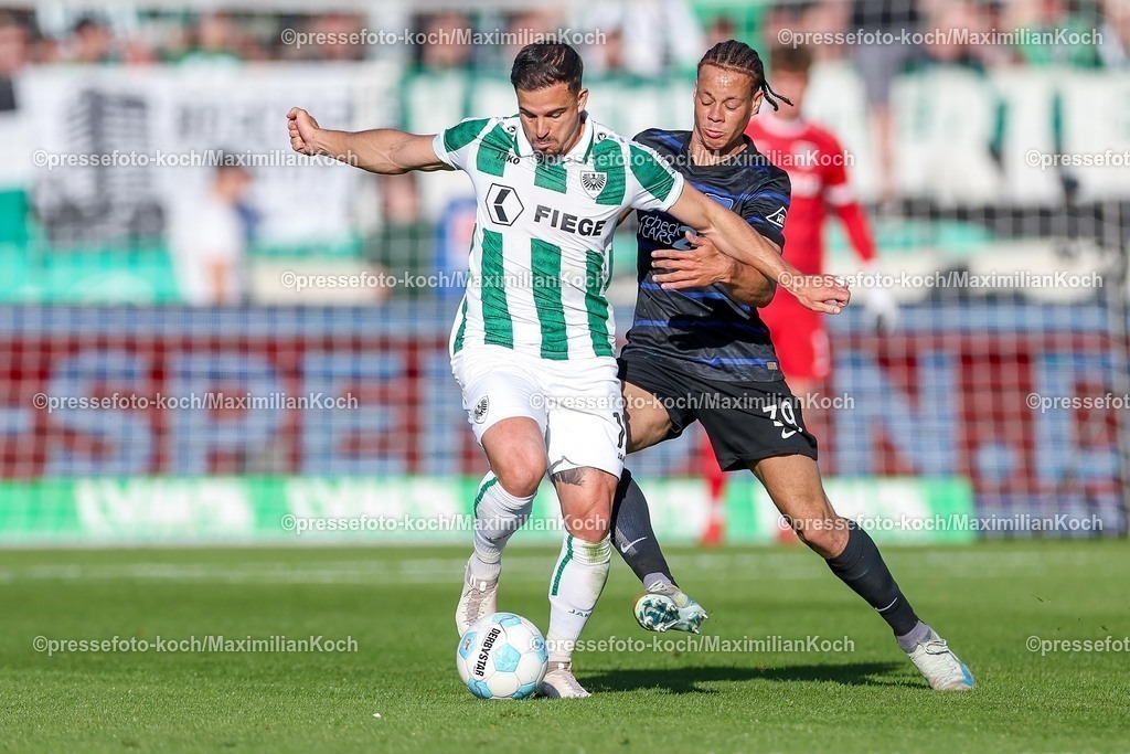 SCP09052501043 | 09.05.2025, Fußball, Preußen Münster - Hertha BSC, 2. Fußball Bundesliga, 33. Spieltag, Preußenstadion, Saison 2024 2025: Sebastian Mrowca (Preussen Muenster #10) im Zweikampf gegen Derry Scherhant (Hertha BSC #39) DFB regulations prohibit any use of photographs as image sequences and or quasi-video.