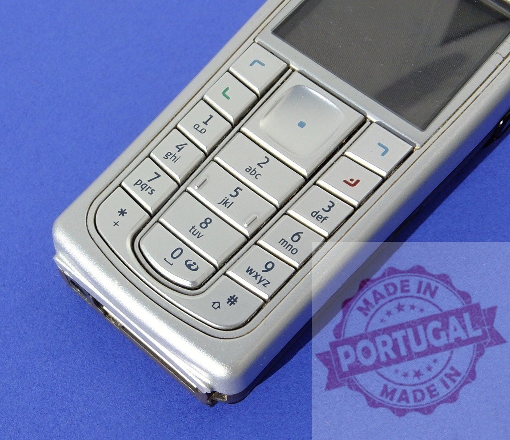Nokia mobile phone showing keypad on blue background | Close-up of a Nokia mobile phone featuring its keypad, highlighting the device's communication capabilities - Realized with Pictrs.com
