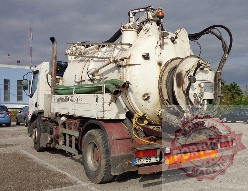 Industrial vacuum truck parked in a large lot | Heavy duty sewer cleaning vacuum truck with large tank and hose equipment - Realized with Pictrs.com