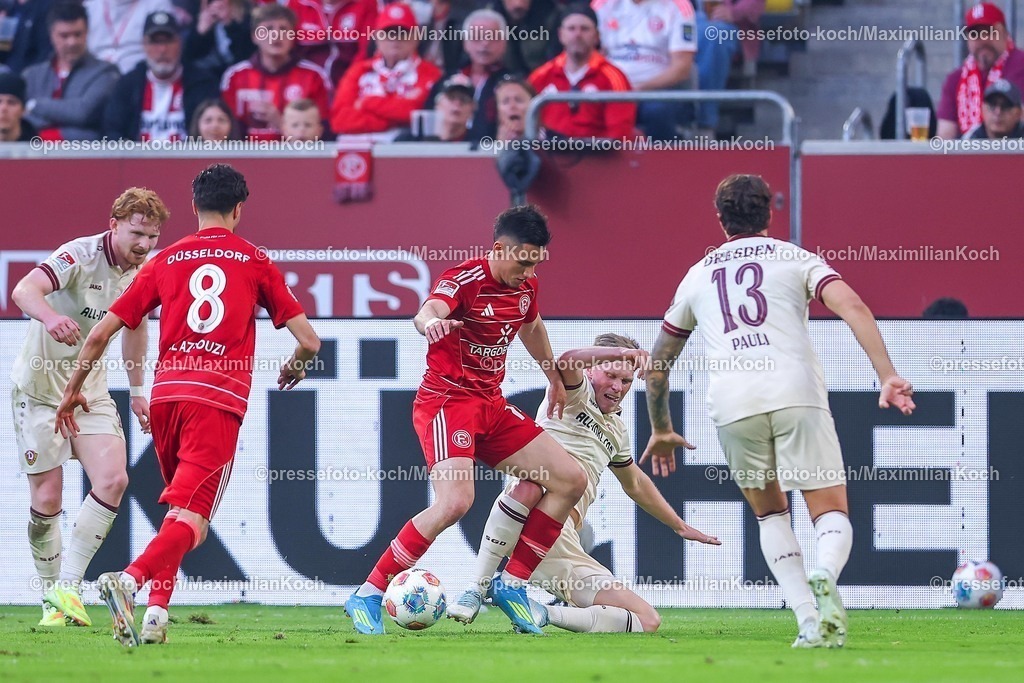 F9524042601072 | 24.04.2026, Fußball, Fortuna Düsseldorf - SC Dynamo Dresden, 2. Fußball Bundesliga, Herren, Merkur Spiel-Arena, 31. Spieltag, Saison 2025 2026: Sotiris Alexandropoulos&nbsp;(Fortuna Düsseldorf #14) im Zweikampf gegen  Jonas Sterner (Dynamo Dresden #32)  DFB regulations prohibit any use of photographs as image sequences and or quasi-video.