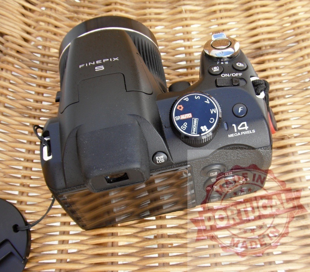 Fujifilm FinePix digital camera for photography and hobby | Black FinePix S series bridge camera on a woven wicker background - Realized with Pictrs.com