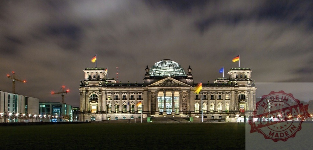 Reichstag Building Berlin Germany at night showing dome | Reichstag building in Berlin, Germany, illuminated at night under a cloudy sky - Realized with Pictrs.com