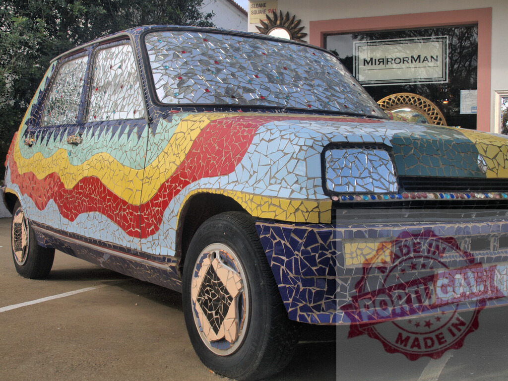 Renault 5 covered in colorful mosaic parked near MirrorMan shop | Renault 5 entirely decorated with a multicolored mosaic is parked in front of a shop called MirrorMan - Realized with Pictrs.com