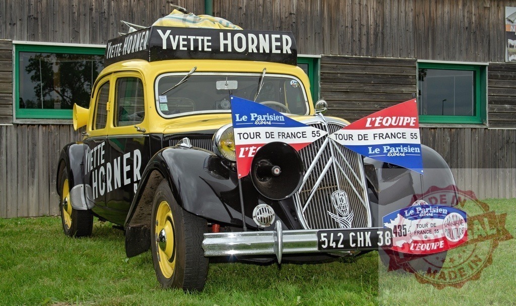 Yvette Horner Citroën Traction Avant car at Tour de France vintage event | Classic Citroën Traction Avant car branded with Yvette Horner and Tour de France 55 logos - Realized with Pictrs.com