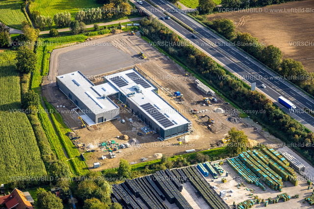 Isselburg241010085 | Luftbild, Gewerbegebiet Heelden an der Autobahn A3 Anschlussstelle Rees, Bundesstraße B67, Baustelle mit Neubau Anhängerzentrum Baumann, Heelden, Isselburg, Nordrhein-Westfalen, Deutschland