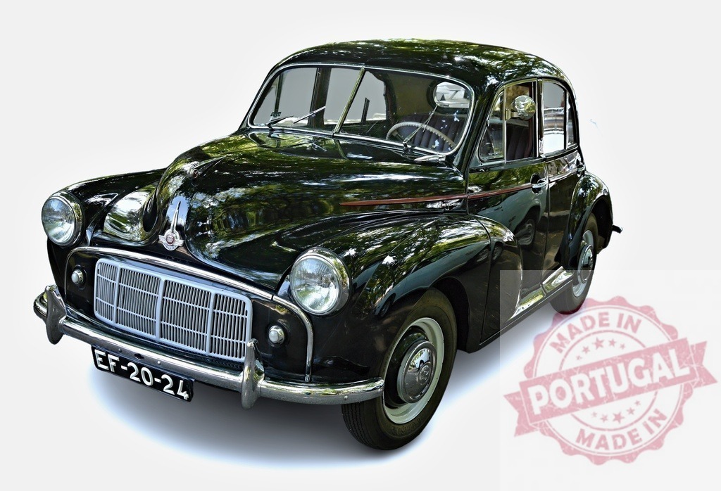 Classic black Morris Minor car parked, showing its vintage elegance | Shiny black Morris Minor car parked, reflecting surrounding trees, showcasing classic British automotive design - Realisiert mit Pictrs.com