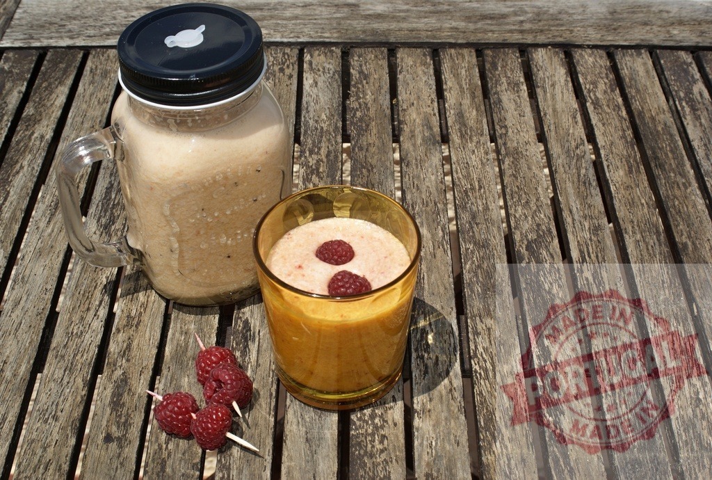 Raspberry fruit smoothie drinks on rustic wood table | Raspberry smoothies are refreshing healthy beverages on a wooden surface - Realized with Pictrs.com