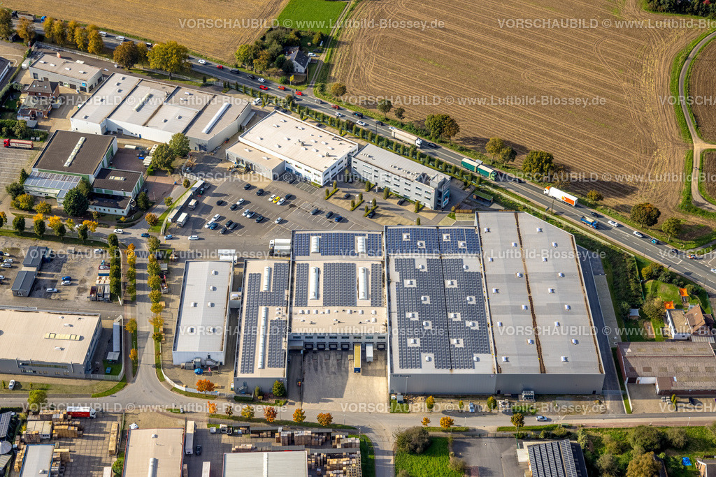 Isselburg241010076 | Luftbild, Gewerbegebiet Heelden an der Autobahn A3 Anschlussstelle Rees, Bundesstraße B67, VKF Renzel Palettenbau mit Solardach, Heelden, Isselburg, Nordrhein-Westfalen, Deutschland