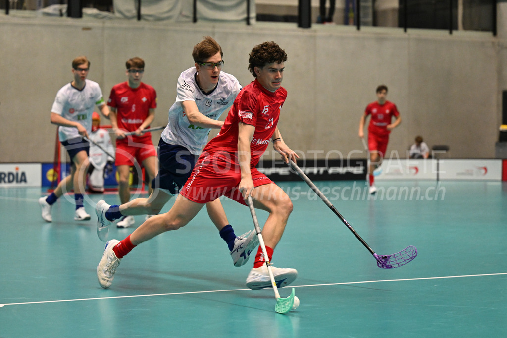Switzerland B U19 vs Finland U19 - 2. February 2024 | Switzerland B U19 vs Finland U19
U19 Men International Matches in Switzerland
GoEasy Arena, Siggenthal Station
Switzerland defender #21 Florin Fehr in front of Finland forward #2 Viljami Engman.
Credit: Markus Aeschimann | <a href="https://www.markus-aeschimann.ch">Sportfotografie Markus Aeschimann</a> | <a href="https://www.instagram.com/sportfotografie.aeschimann">@sportfotografie.aeschimann</a> - Realisiert mit Pictrs.com
