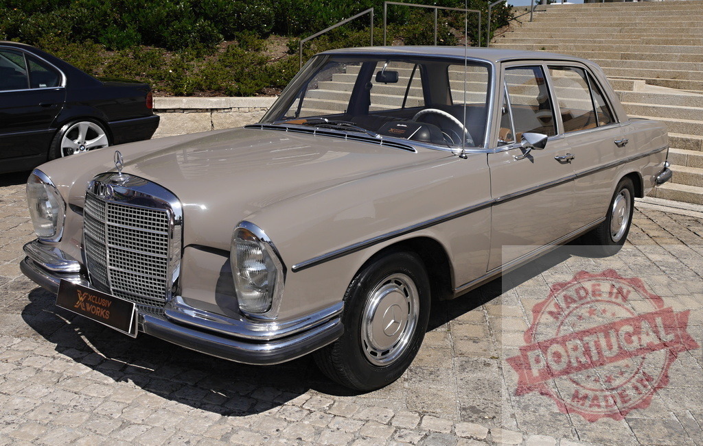 Mercedes-Benz W108 vintage luxury car parked on cobblestones | Mercedes-Benz W108 classic sedan showcasing automotive heritage and timeless design - Realized with Pictrs.com