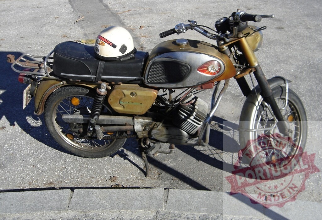 Vintage motorcycle parked on the street with helmet resting on the seat | Old motorcycle parked on the side of a street with a helmet resting on the seat, evoking a sense of nostalgia and freedom - Realized with Pictrs.com