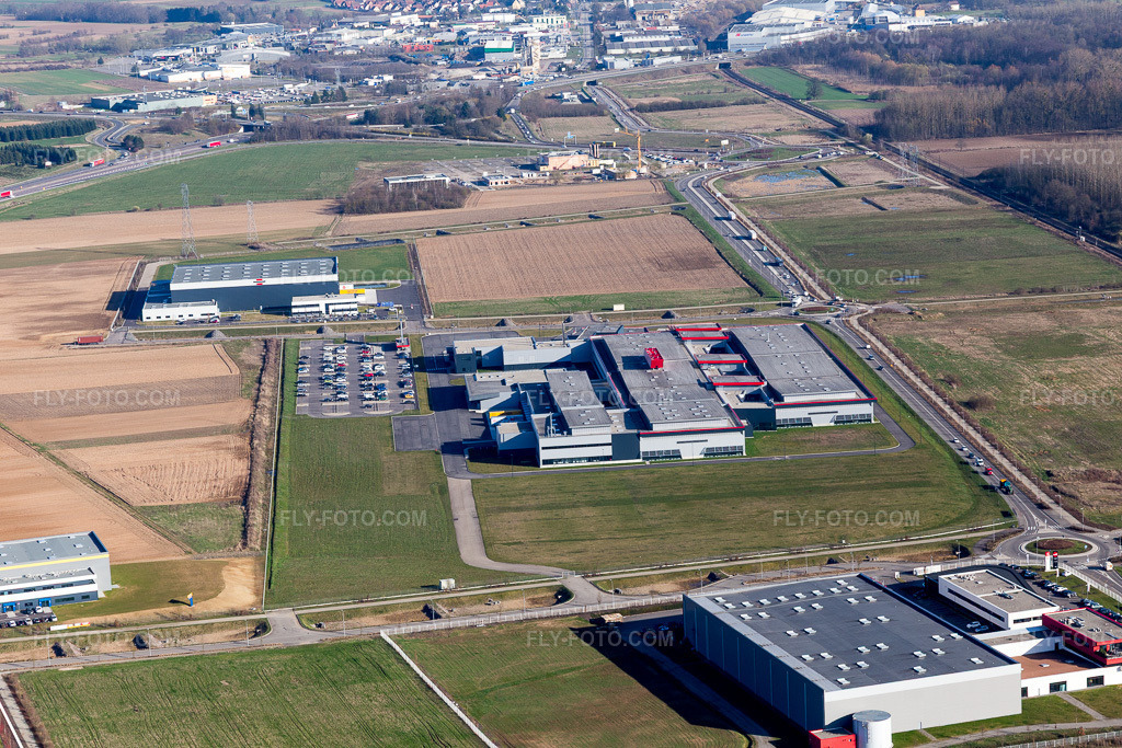 Aerial view: SEW-USOCOME factory premises in Brumath in Bernolsheim in Mommenheim in the state Bas-Rhin, France. – Photo: IMG_097626.jpg taken on 03/16/2017 by Werner Riehm/FLY-FOTO.com – Resolution of the original: 5472 x 3648 px