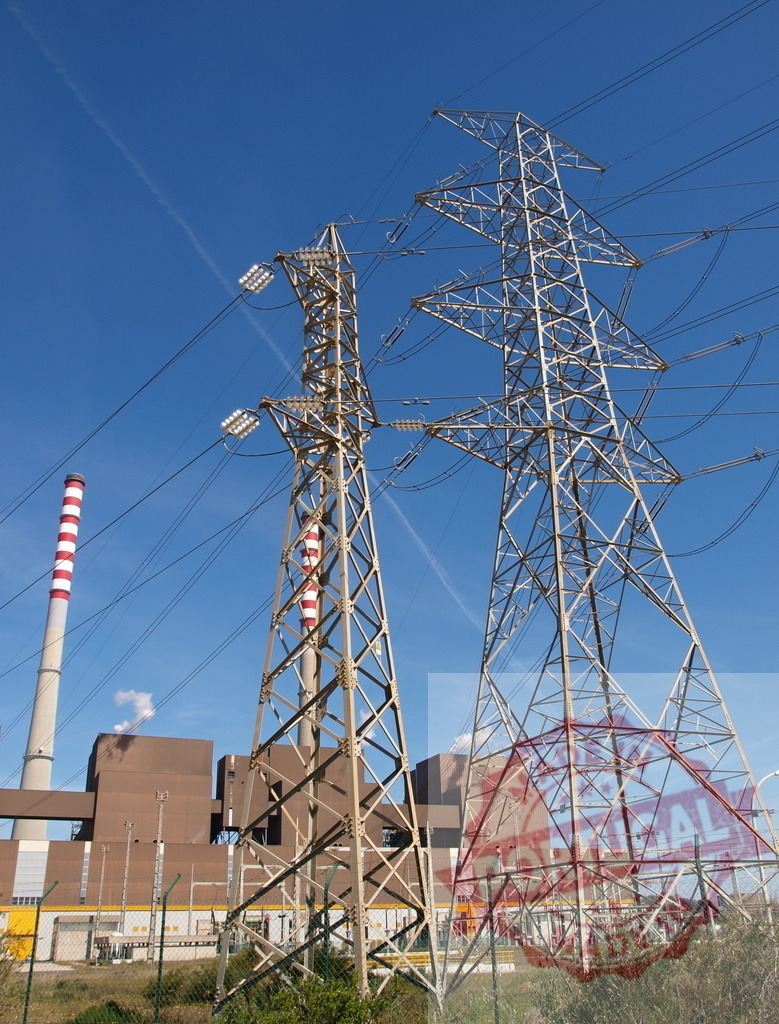 Electricity generation power plant with transmission lines | Industrial power station generating electricity with high voltage pylons and smokestacks against blue sky - Realized with Pictrs.com