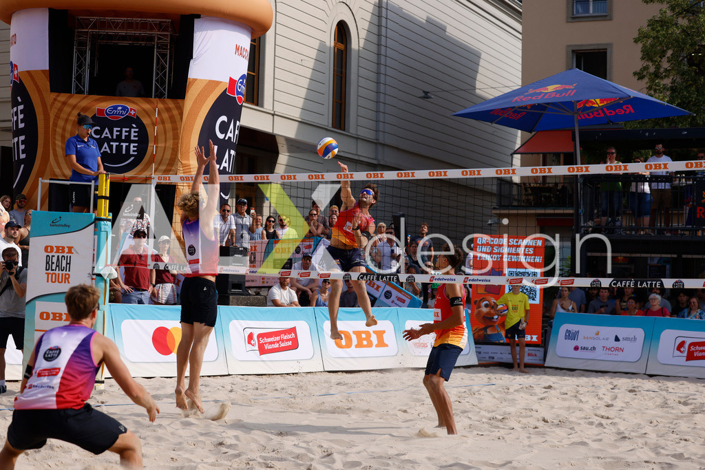 Obi BeachTour 2026 - Basel | BASEL, SWITZERLAND - JULY 19: LEO DILLIER (SUI) attack / spike against MATHIS KÄLIN (SUI) block during the Obi BeachTour 2026 match between DILLIER / FLÜCKIGER (SUI) and BREER / KÄLIN (SUI) at Barfüsserplatz on July 19, 2026 in Basel, Switzerland. - Realisiert mit Pictrs.com
